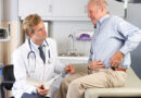 Doctor Examining Male Patient With Hip Pain